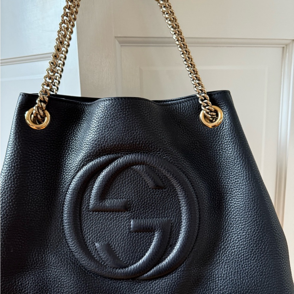 Gucci Black and Gold Leather Shoulder Bag with Embossed Logo